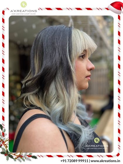 A high-fashion look combining a dark base with a split dye of platinum blonde and pastel blue for a truly artistic and unique style.
