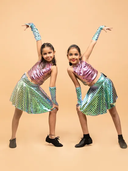 Two of our little mermaids striking a pose. Our themed performances help kids get into character and build their stage presence in a fun, imaginative way.