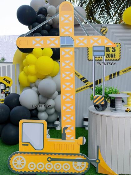 A large crane and bulldozer prop, essential elements for creating an immersive construction site theme.