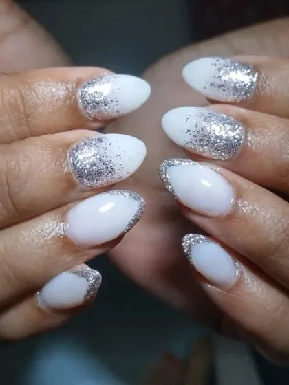 Another shot of these minimal glitter bridal nails, showing how the glitter is applied differently on each nail for a unique touch.
