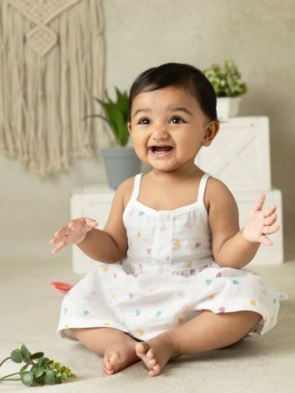 My boho-themed sessions use natural textures like macrame, wood, and greenery to create a calm and earthy setting that beautifully complements your child's simple joy.