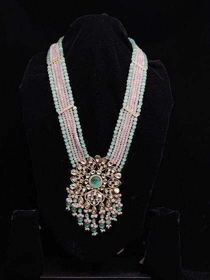 A unique combination of pastel pink and mint green beads makes this long necklace a standout piece. Rent it for your mehendi or sangeet for a fun, colourful look.
