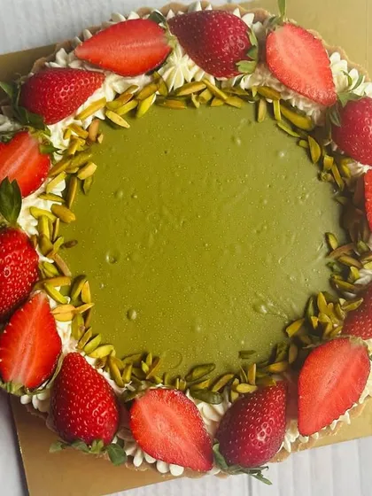 Indulge in my Pistachio Cheesecake Tart, topped with velvety pistachio cream, crunchy pistachio slivers, and fresh, juicy strawberries.