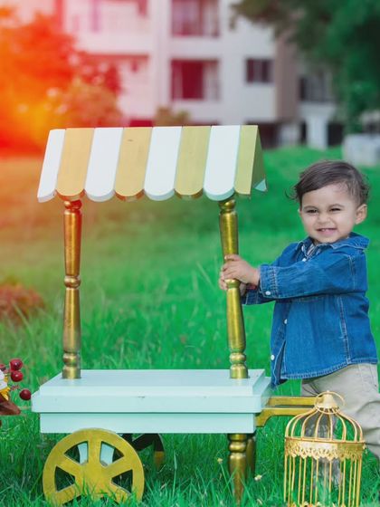 This little boy is having fun with the ice cream cart, with a beautiful sun flare in the background.