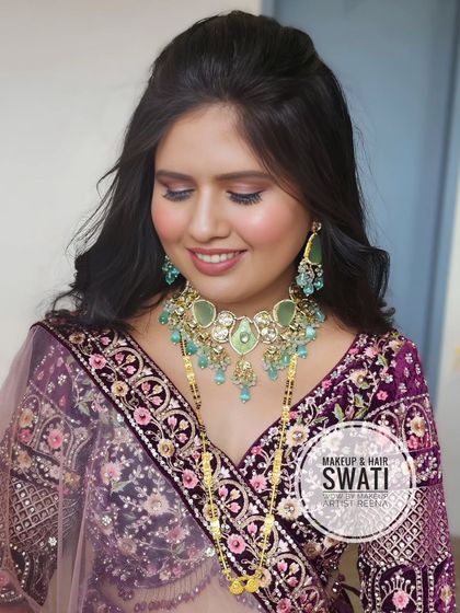 A lovely reception look for our bride Pranali. My artist Swati created a soft, romantic hairstyle and makeup that complemented her beautiful purple lehenga.