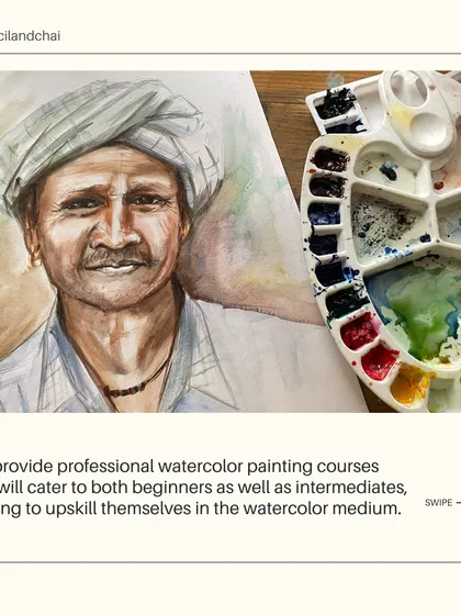 A student's watercolor portrait next to a messy palette. This image perfectly captures the beautiful chaos of the creative process in our professional courses.