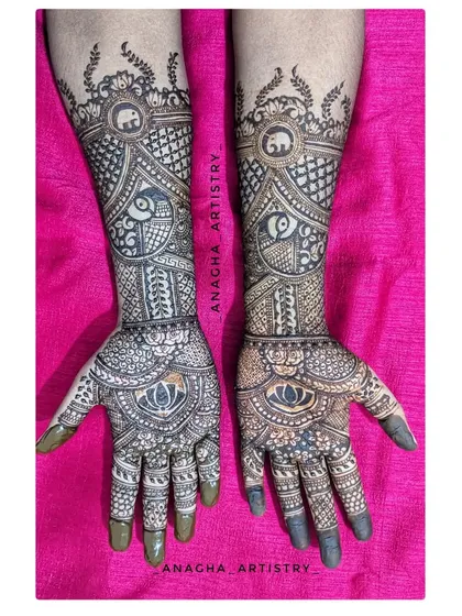 An intricate engagement bridal mehendi. This design is perfect for brides who want a full look without figures, focusing instead on dense patterns like peacocks, elephants, and lotuses.