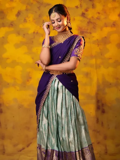This half-saree look is perfect for younger clients. The jewellery is traditional but styled in a way that is fresh and youthful.