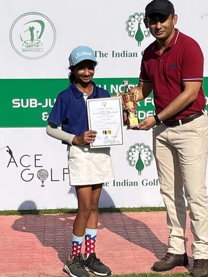 Aaradhya Rawat receiving her winner's trophy at the IGU feeder tournament in Meerut.