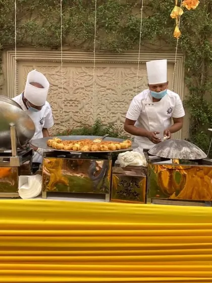 A live tawa station at a Haldi ceremony. My chefs are preparing hot and fresh appetizers for guests, adding an element of theatre to the dining experience.
