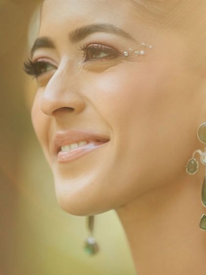 A close-up showing the subtle shimmer on the eyes and the glowing skin, perfect for a magical-themed event.