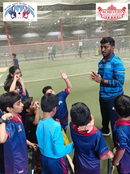 A coaching session in progress at CYCA, with our coach addressing a group of young American players.