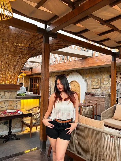 A full-length shot of my outfit at Tahia. This shows how I integrate my personal style into my restaurant reviews.