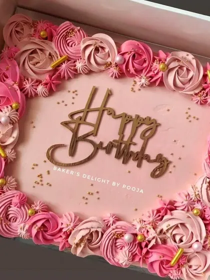 This pink ombre floral sheet cake is perfect for a large birthday gathering. It's a practical way to serve many guests while still offering a beautiful, handcrafted dessert.