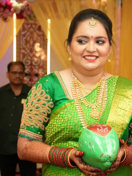 My lovely Telugu bride Gayathri in a vibrant green silk saree for one of her wedding functions.