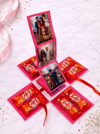The big reveal! This photo explosion box opens up to display a waterfall of pictures in the center, with KitKat chocolates on each of the four flaps.