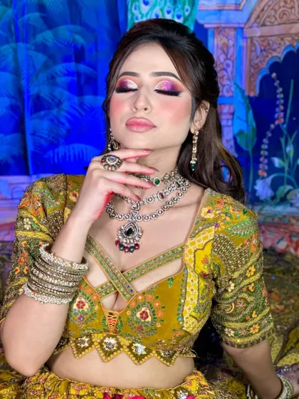 Another beautiful shot of the Mehendi makeup. The skin is kept fresh and dewy to balance the bold eye look.