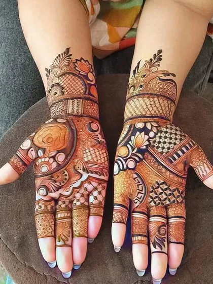 This design features a mix of colorful and intricate patterns. The use of shading and different motifs like flowers and paisleys gives it a unique, artistic feel.