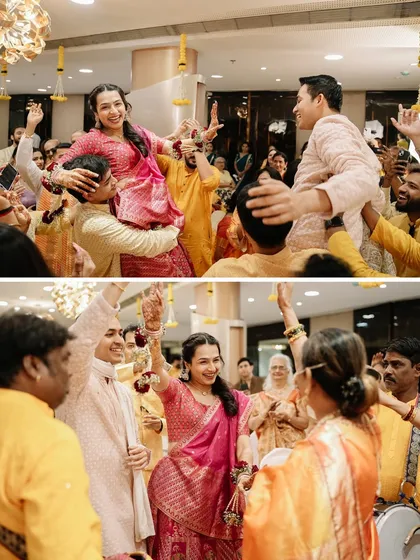 The bride and groom lifted on the shoulders of their friends and family, dancing with joy. The Haldi is all about this kind of fun.