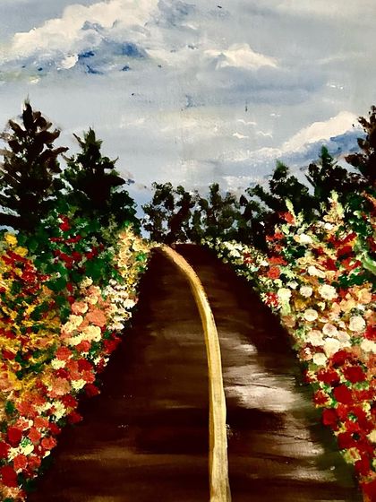 A painting of an endless road, symbolizing life's journey. The path is lined with flowers, representing the good experiences we encounter along the way.