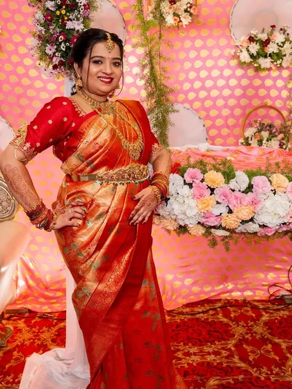 A classic makeover for a mother celebrating her daughter's naming ceremony. The makeup is elegant and refined, designed to complement her traditional silk saree and gold jewelry, ensuring she looks and feels beautiful on this important family occasion.
