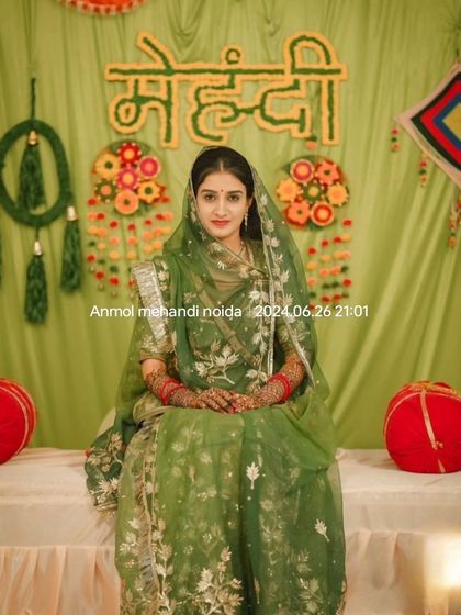 A stunning portrait of a bride in her full mehendi ceremony attire, looking serene and beautiful.