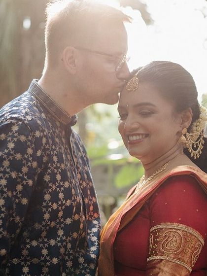 A tender moment between Ankita and her German husband Rolland, capturing the love that brought their cultures together.