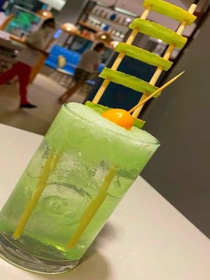 A refreshing green mocktail with a creative cucumber garnish. We believe that even the simplest drinks should be presented with a touch of creativity.