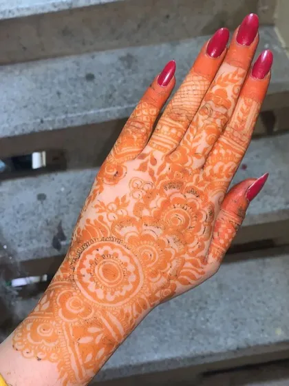 This is the beautiful, deep orange stain that develops after the henna paste is removed. I achieve this rich, natural color by using my own freshly made, chemical-free henna cones, ensuring a safe and stunning result.