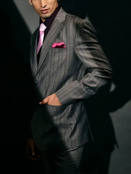 This is your perfect formal look, a two-button coat with pants, shirt, tie, and pocket square, all customizable at Manhar.