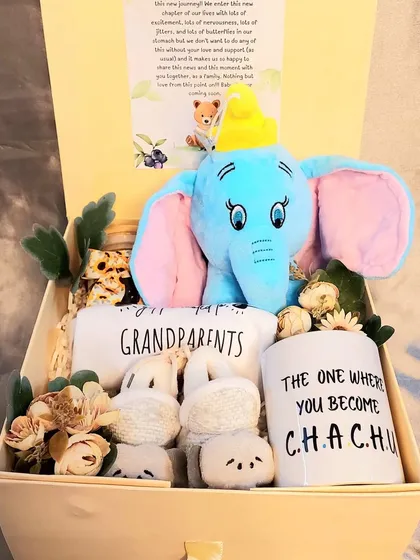 We helped a couple in the USA announce their pregnancy to family in India with this hamper. It includes a soft toy, custom mugs for the new 'Chachu', and a romper for the grandparents.