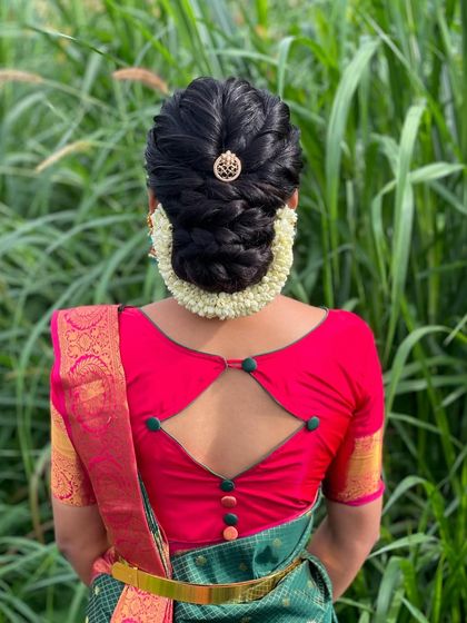 The full view of the hairstyle, showing how it complements the keyhole-back blouse design.