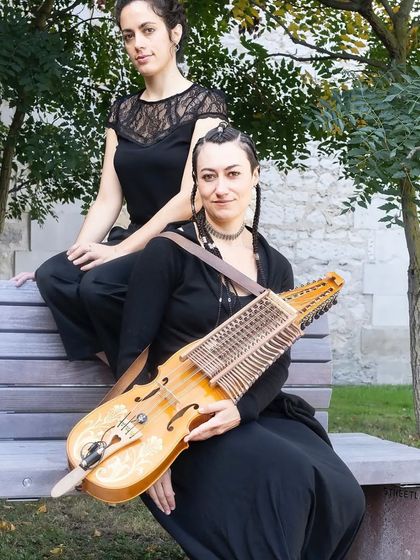 A portrait of the two artists from 'Pajarillo Verde' with the Nyckelharpa. This musical tale explores the theme of adoption through songs and lullabies from around the world.