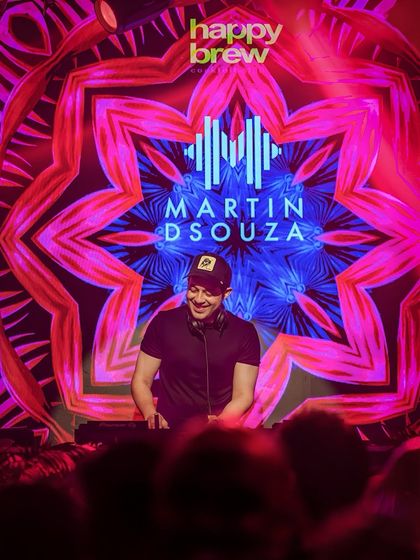 Me at the console against the backdrop of the iconic Happy Brew and Martin Dsouza visuals.