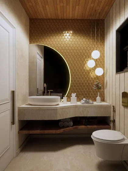 This elegant bathroom features a unique combination of metallic gold mosaic tiles, a custom fluted vanity, and warm wood ceilings for a touch of luxury.