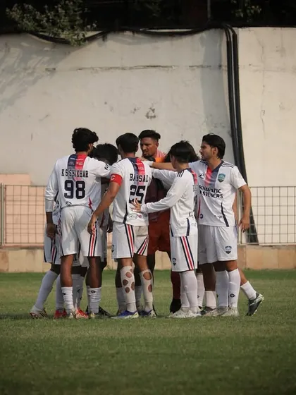 The team huddles before the first game of the season. Unity and focus from the very start.