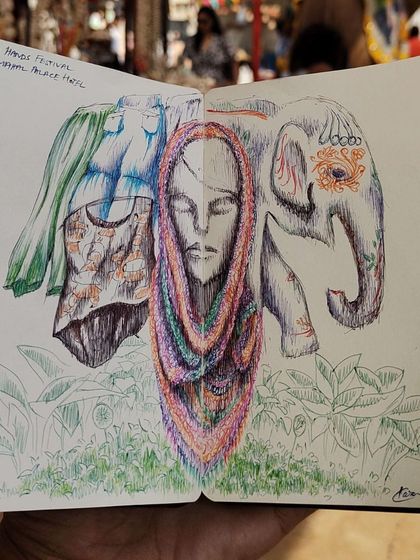 A creative sketchbook entry from the festival, blending drawings of clothing, the elephant, and a central portrait.