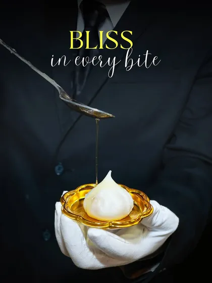 I believe in serving tradition with a touch of elegance. Here, one of my team members is drizzling golden ghee over a handcrafted Ukadiche Modak, a classic Maharashtrian sweet, presented on a golden plate for a truly royal feel.