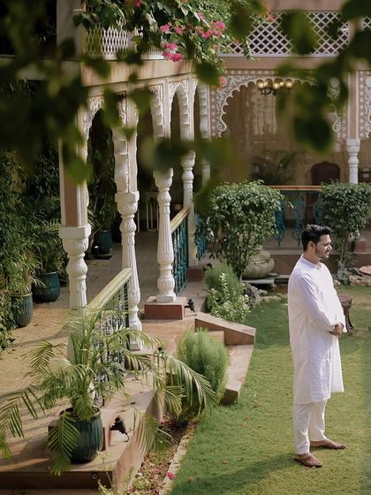 A solo portrait of the groom, looking thoughtful in the beautiful gardens of the shoot location. It's important to capture individual portraits as well as couple shots.