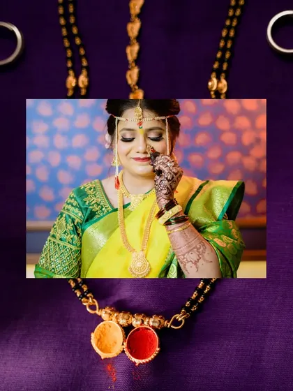 A creative shot focusing on the Mangalsutra, a key symbol in a Maharashtrian wedding. The bride's emotional expression and the intricate details of her mehndi are beautifully framed.