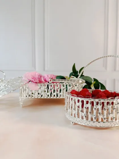 Another angle showcasing the different shapes and sizes of our silver-plated baskets. Whether for holding flowers or festive treats, they add a touch of elegance to any setting.