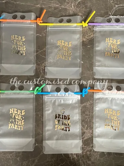 Unleash the fun with these "Here for the Party" drink pouches. They are a great, reusable favor for guests at a bachelorette party, mehendi, or cocktail night.