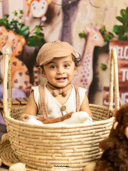 A sweet smile from the birthday boy in his jungle-themed session.