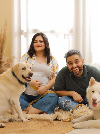 A fun and candid family portrait with two very happy dogs. We believe in capturing the real, joyful chaos of family life.