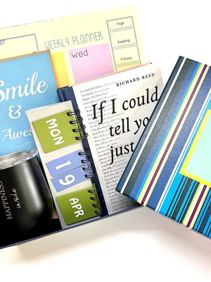 Our 'Escape to Happiness' boxed gift set is perfect for any occasion, from birthdays to Mother's Day. It's packed with a planner, calendar, book, and sipper to inspire joy.