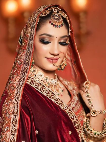 A beautiful portrait of the bride, showing off her intricate jewelry and the flawless finish of her makeup.