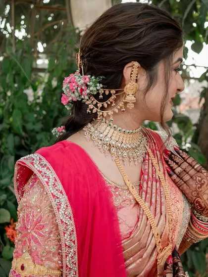 A side profile showcasing the intricate hairstyle and jewelry for this engagement look. The makeup is kept elegant to balance the ornate details.