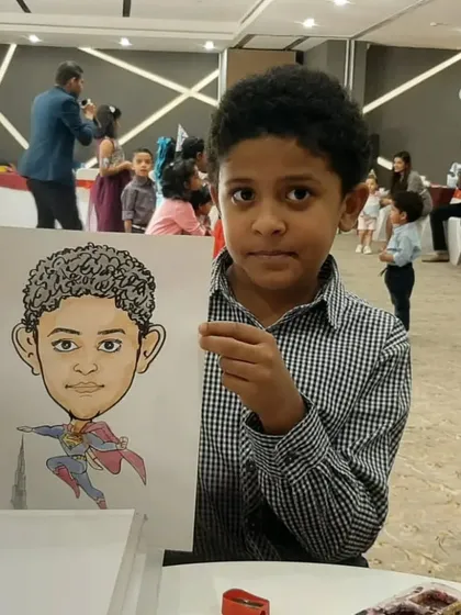 Every kid wants to be a superhero! I love creating themed caricatures like this one, turning a young guest into Superman for a fun and empowering birthday party souvenir.