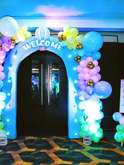 The celebration starts the moment your guests arrive. We created this enchanting welcome arch for a naming ceremony, using a pastel balloon garland and hot air balloon cutouts to set a whimsical tone from the very beginning.