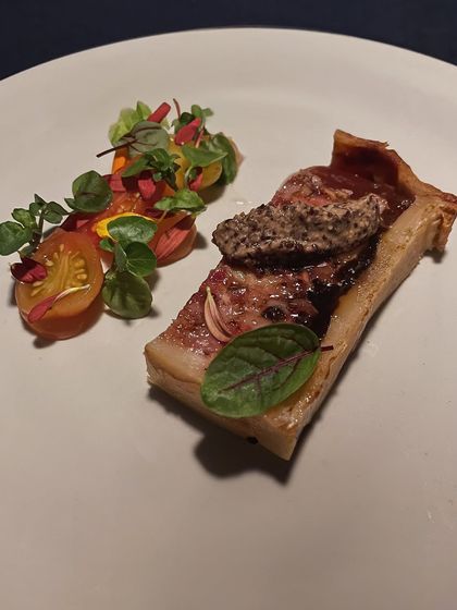 A modern take on a classic: Pâté of Pork and Duck. It's served with a grapefruit and Calvados glaze and a sharp tomato gastrique to cut through the richness.